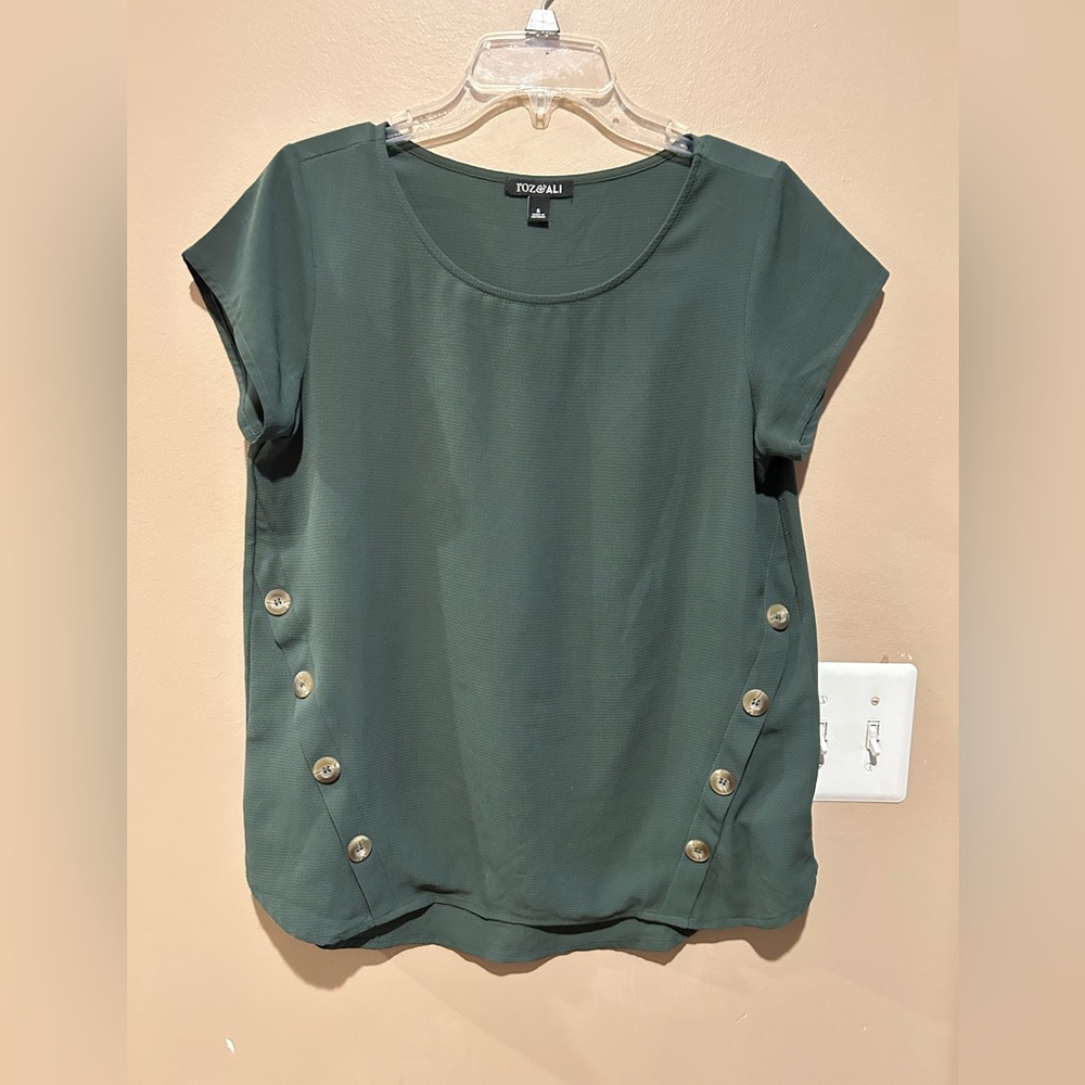 Casual green polyester tops very flattering for all figures. Size Small